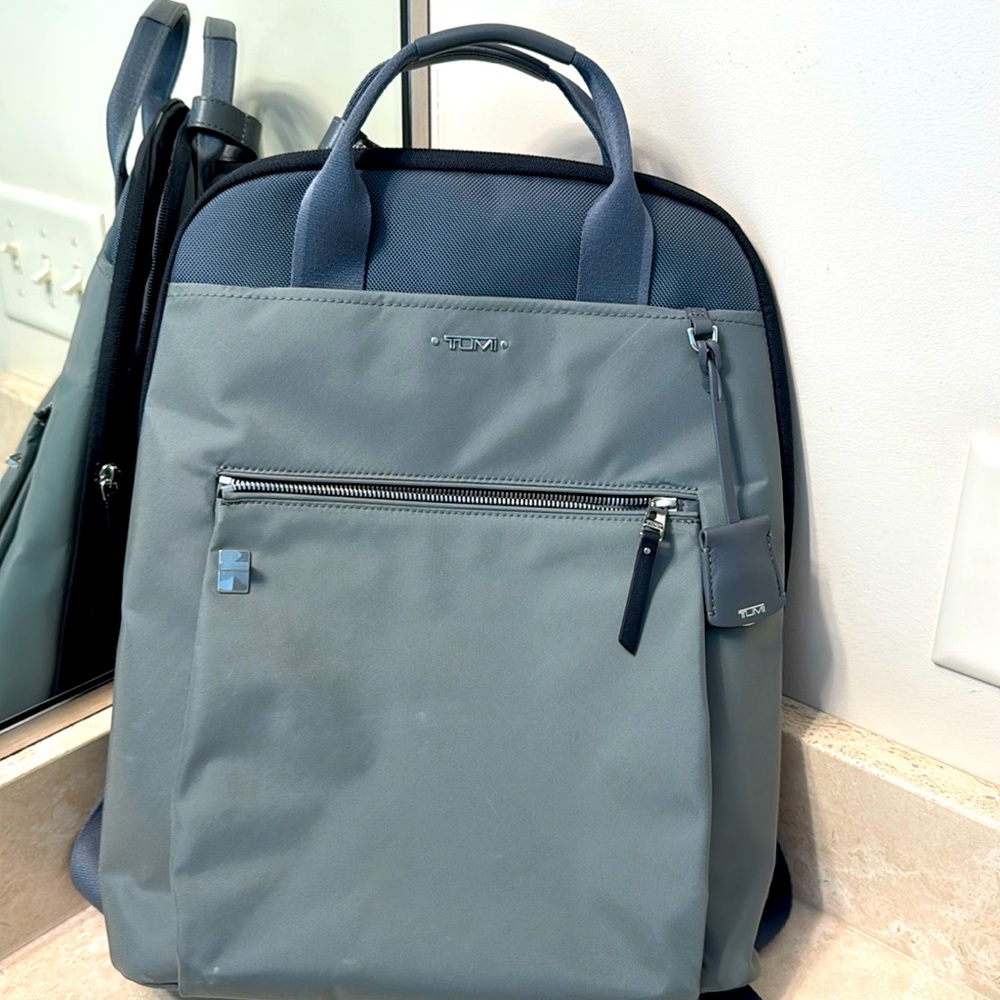 Tumi backpack; grey.
